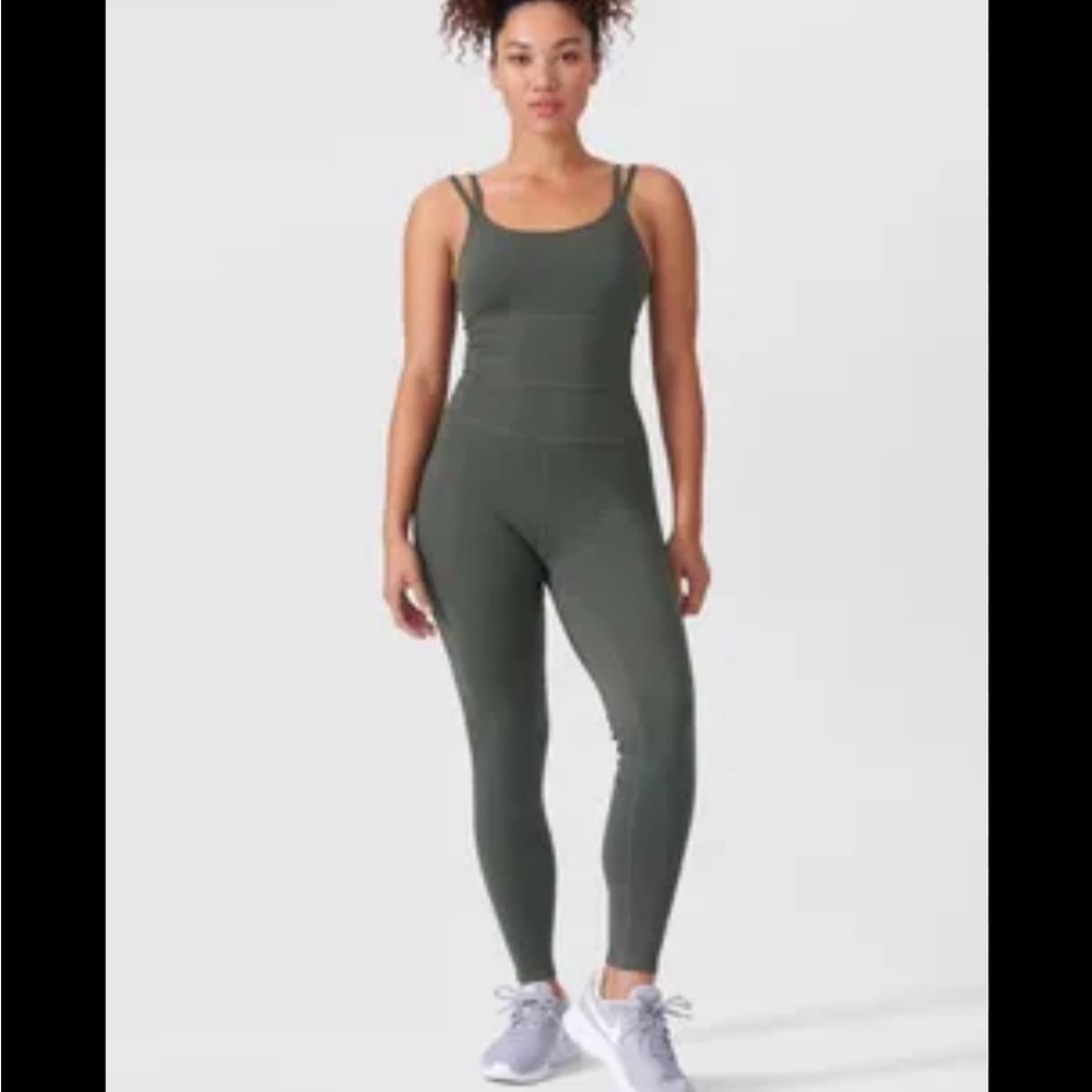 NWT Universal standard Teal Jumpsuit bodysuit next to naked